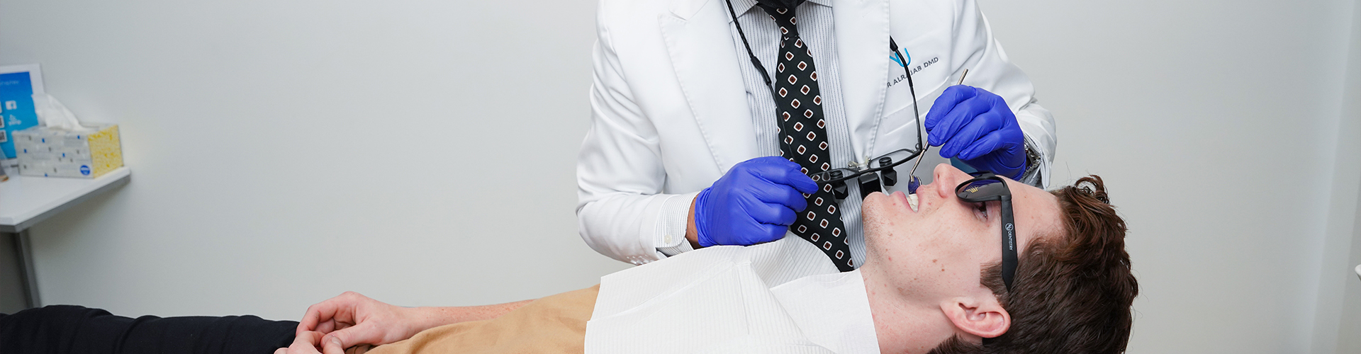 A man being examined by a dentist.