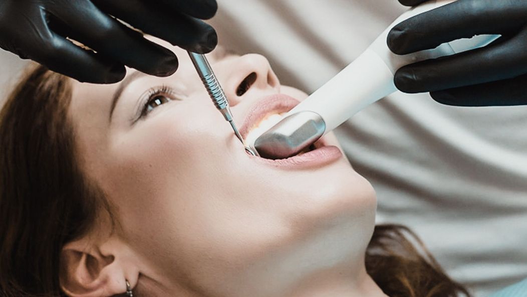 An image of a lady going through a dental procedure