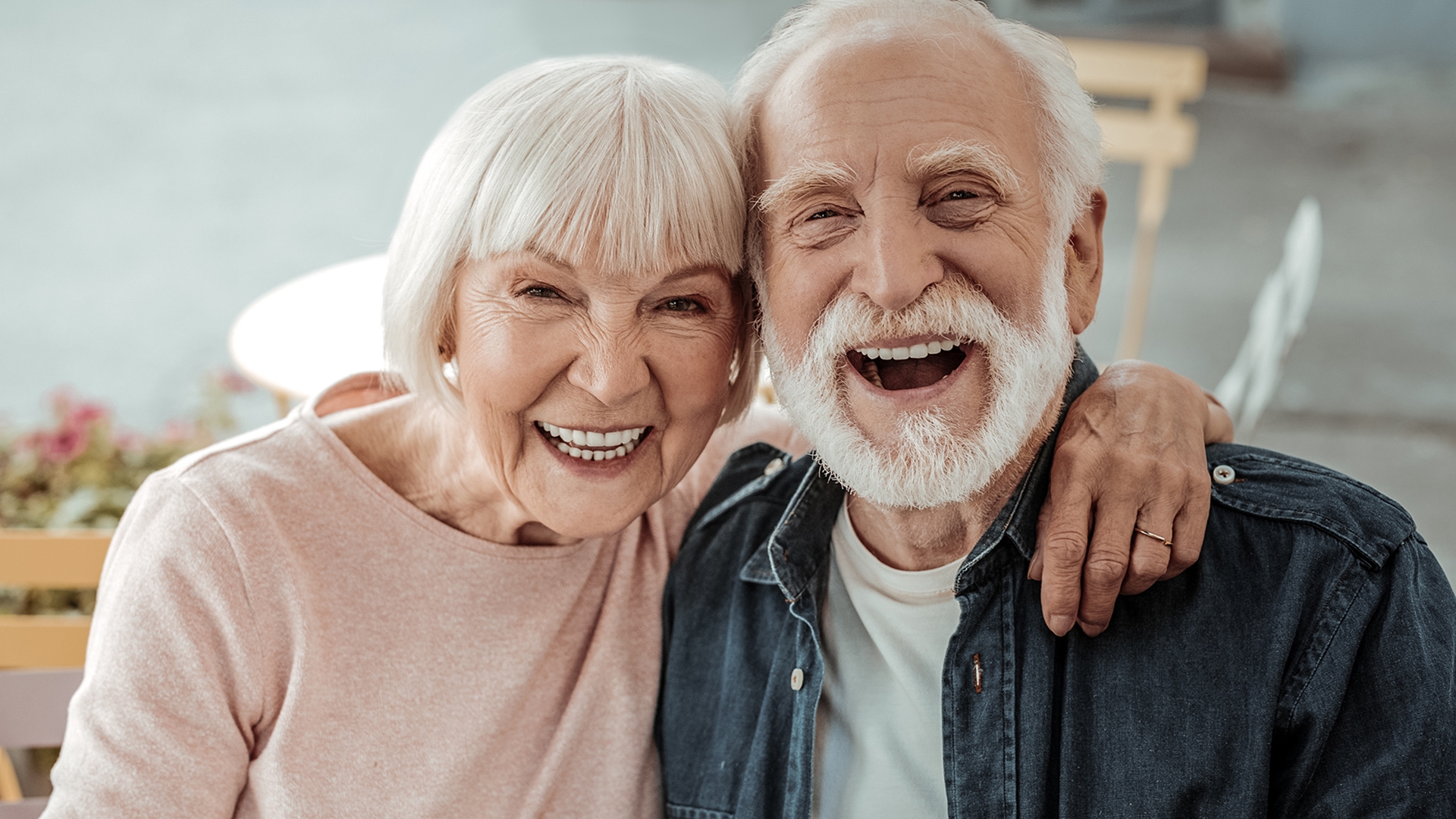 An image of a elderly couple laughing 
